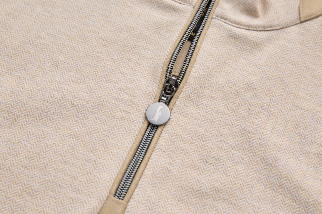 Quarter zipper pull on herringbone top with round logo button