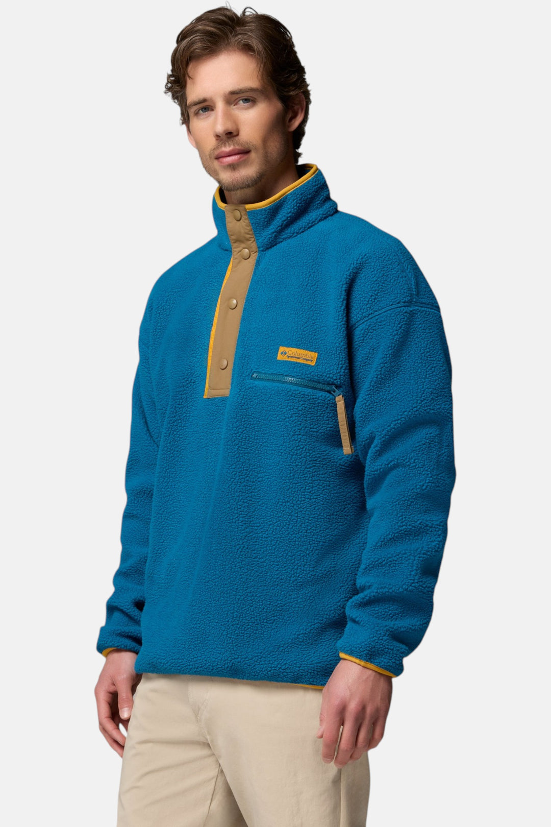 Men's blue fleece pullover with half-snap placket and tan chest pocket trim