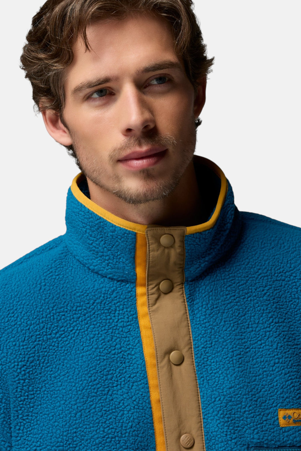 Men's blue fleece pullover with half-snap placket and tan stand collar