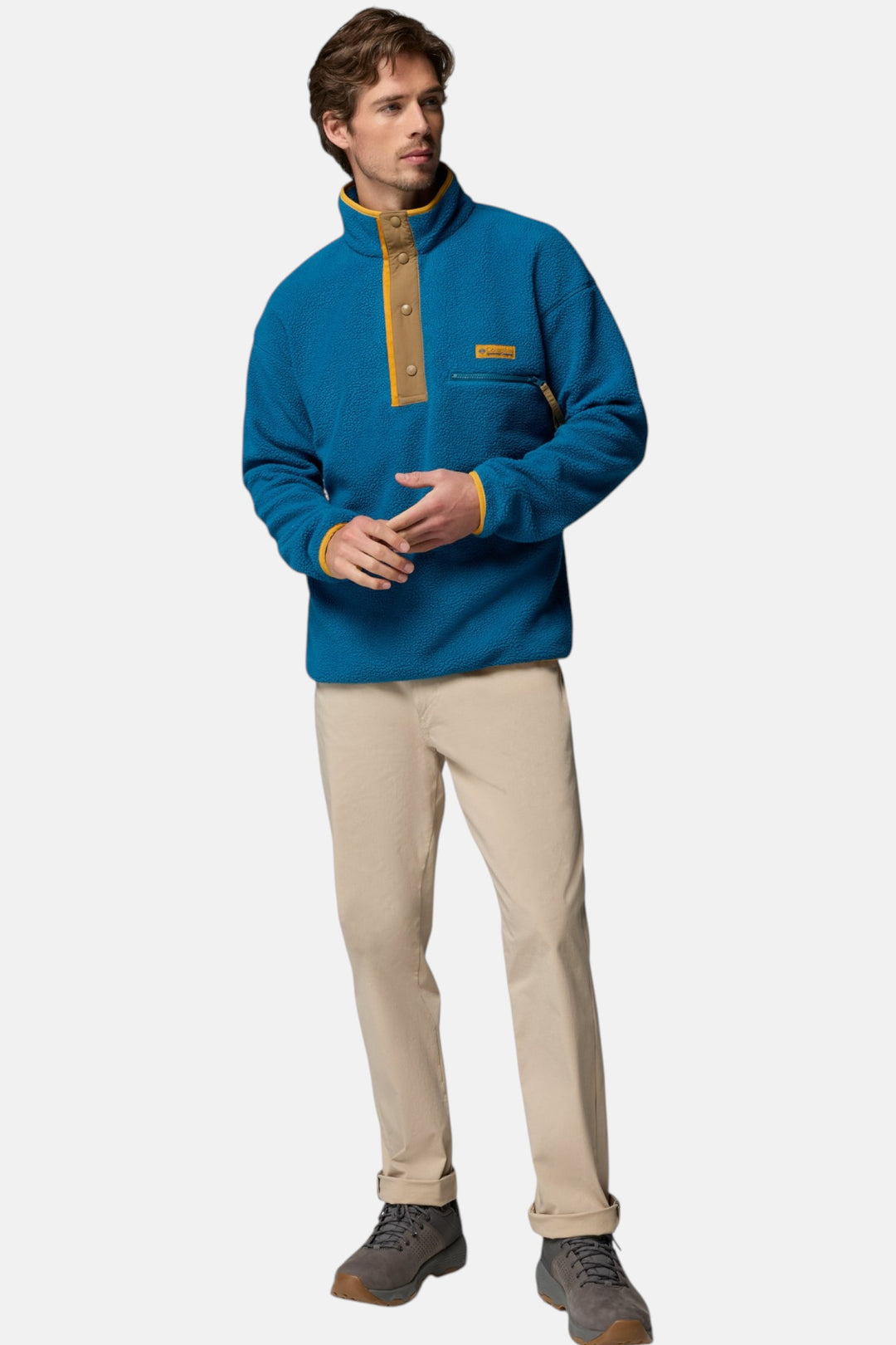 Men's blue fleece pullover with half-snap placket and chest pocket, full body
