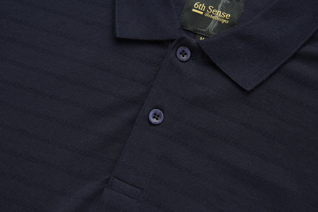 Dark navy polo shirt with buttoned placket and short sleeves