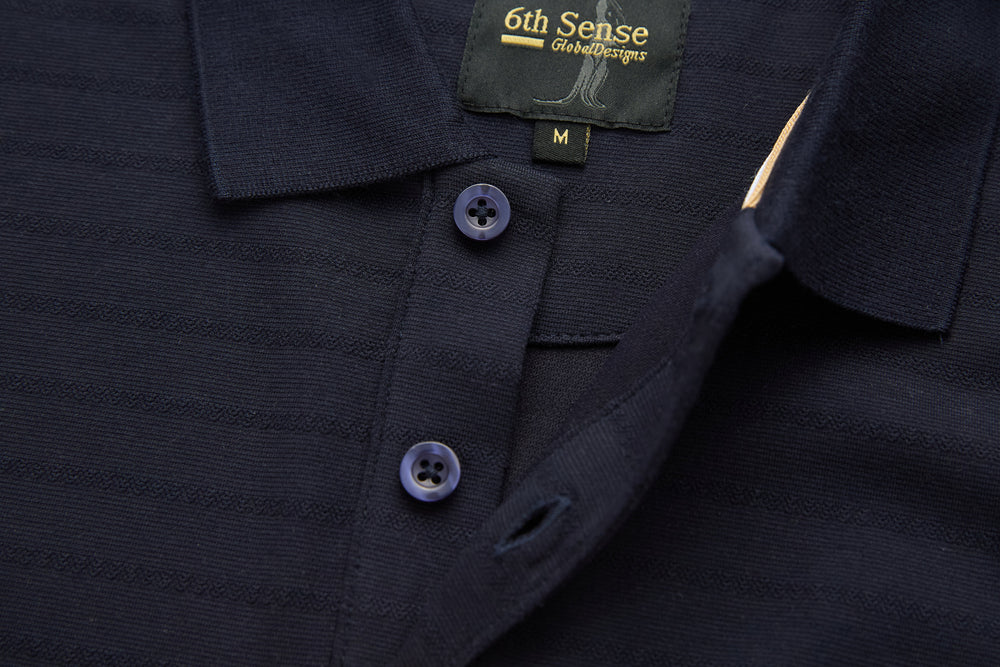 Dark navy polo shirt close-up: two buttons on placket and collar