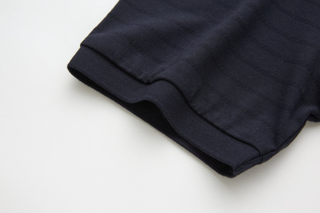 Dark navy polo shirt hem with side seam stitching