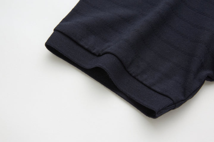 Dark navy polo shirt hem with side seam stitching