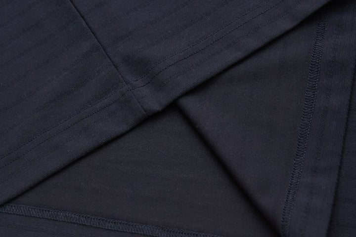 Dark navy polo shirt fabric with seams under placket detail