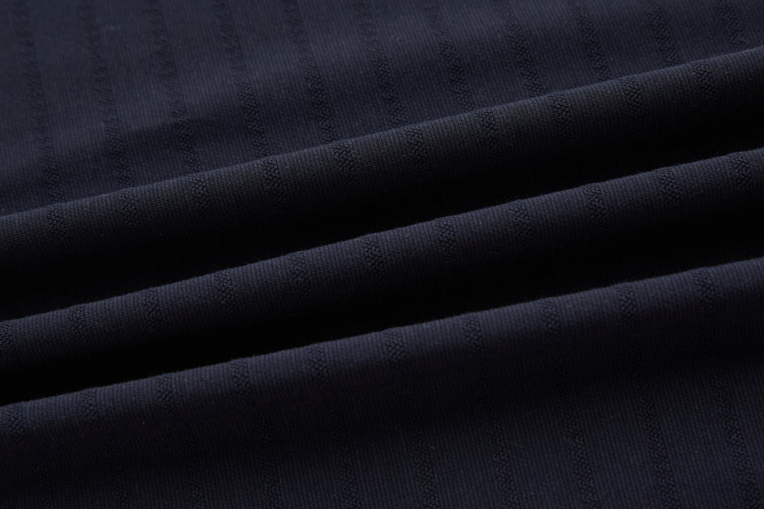 Dark navy polo shirt fabric texture close-up