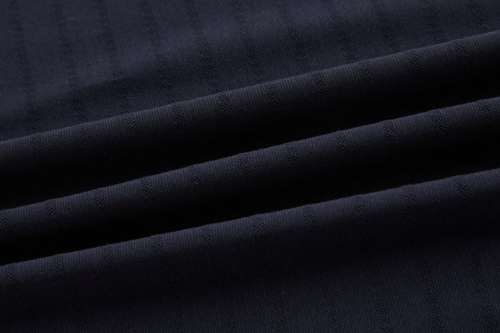 Dark navy polo shirt fabric texture close-up