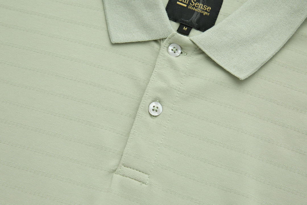 Sage polo shirt with three white buttons and point collar