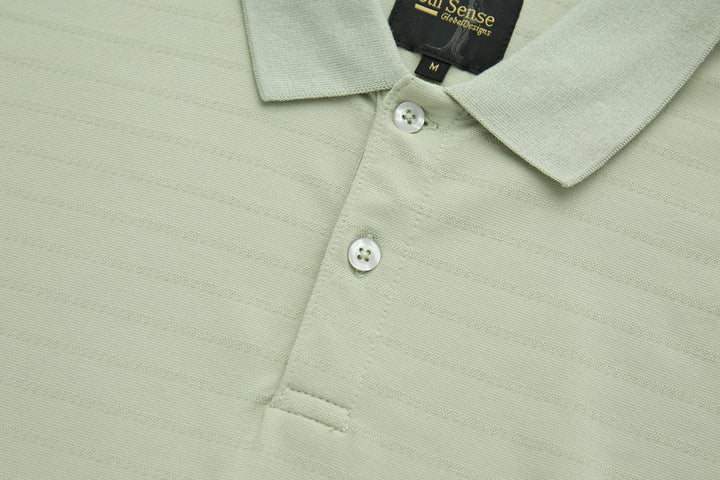 Sage polo shirt with three white buttons and point collar