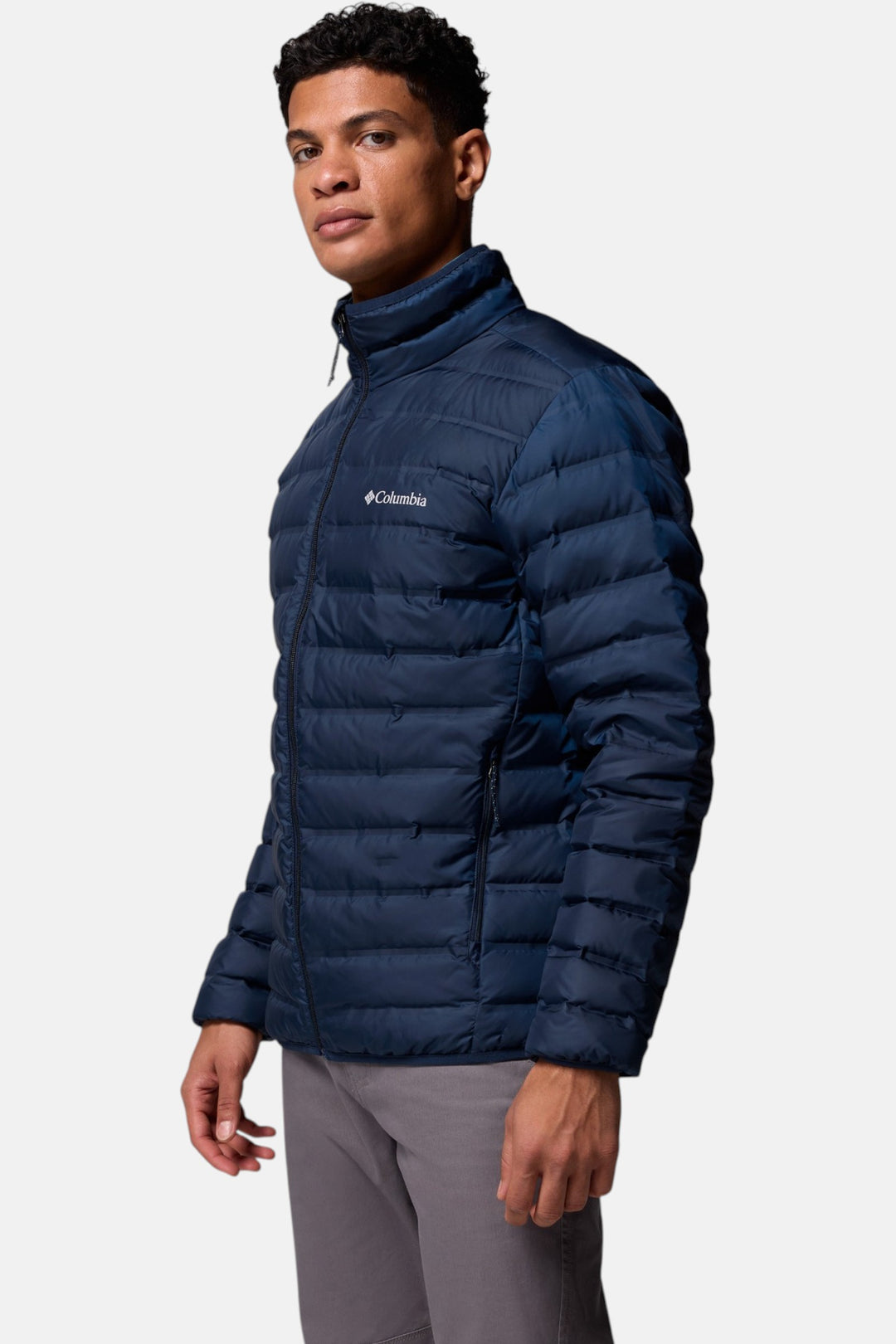 Men's navy down puffer jacket side view with full-zip front and quilted baffles