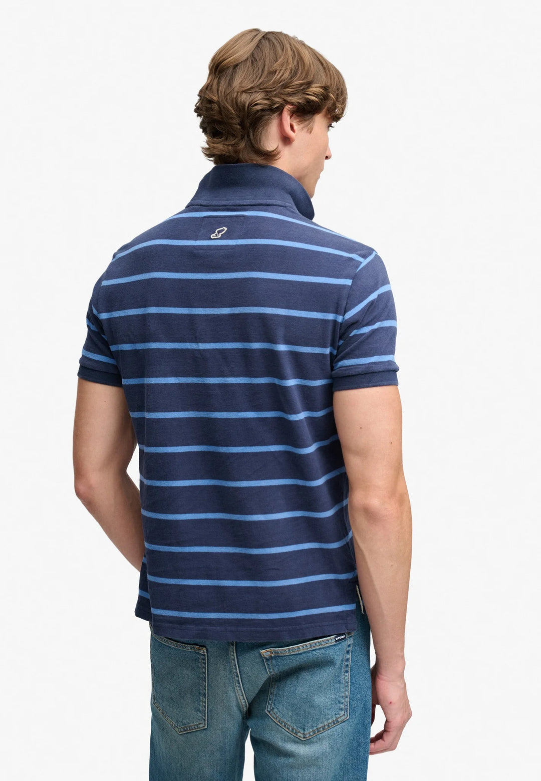 Back view of navy blue striped jersey polo shirt with short sleeves