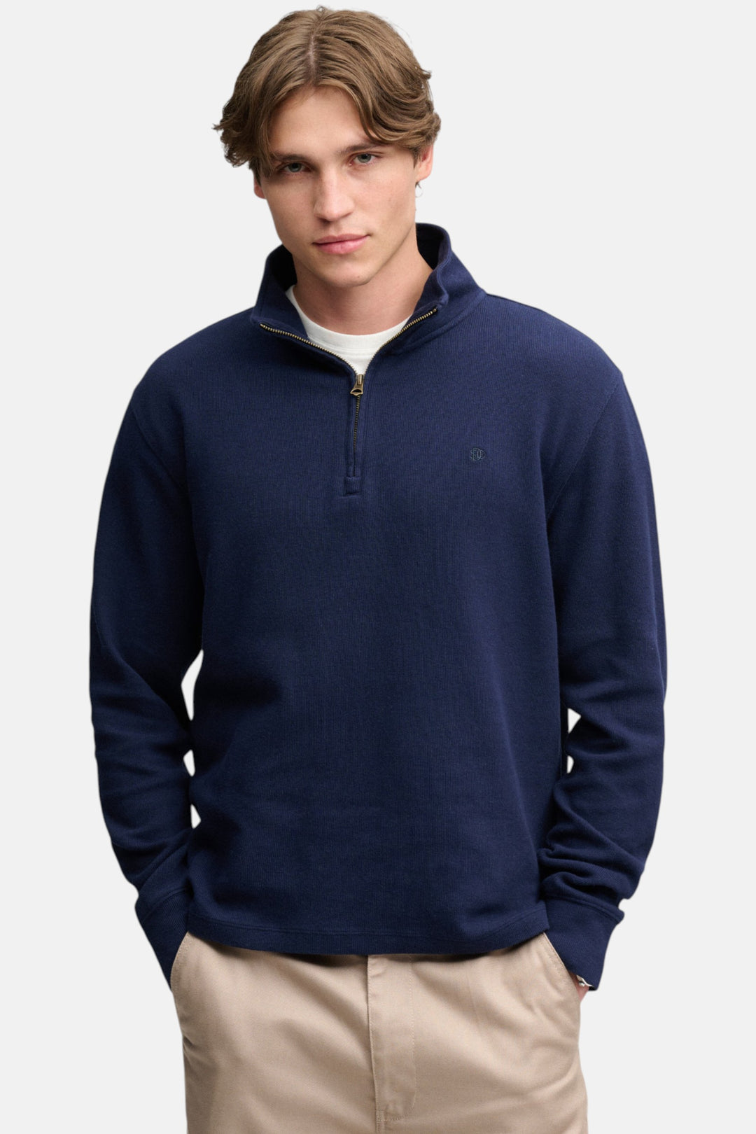 Navy half-zip sweatshirt top with stand collar and long sleeves, chest logo detail