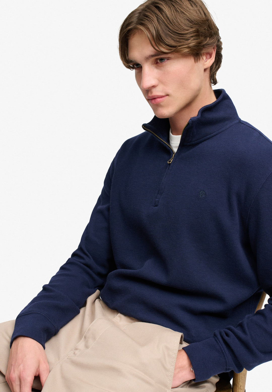 Navy half-zip sweatshirt top with long sleeves and ribbed cuffs, chest logo