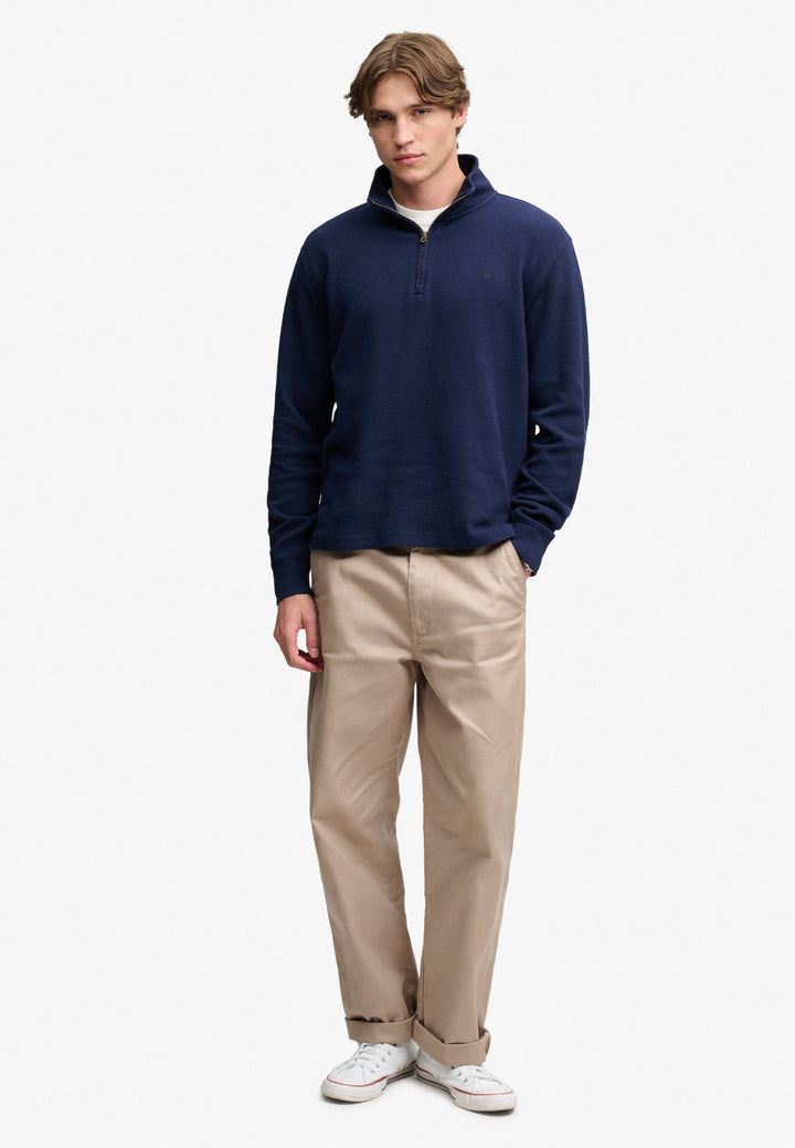 Navy half-zip sweatshirt top with stand collar, front half zip and long sleeves
