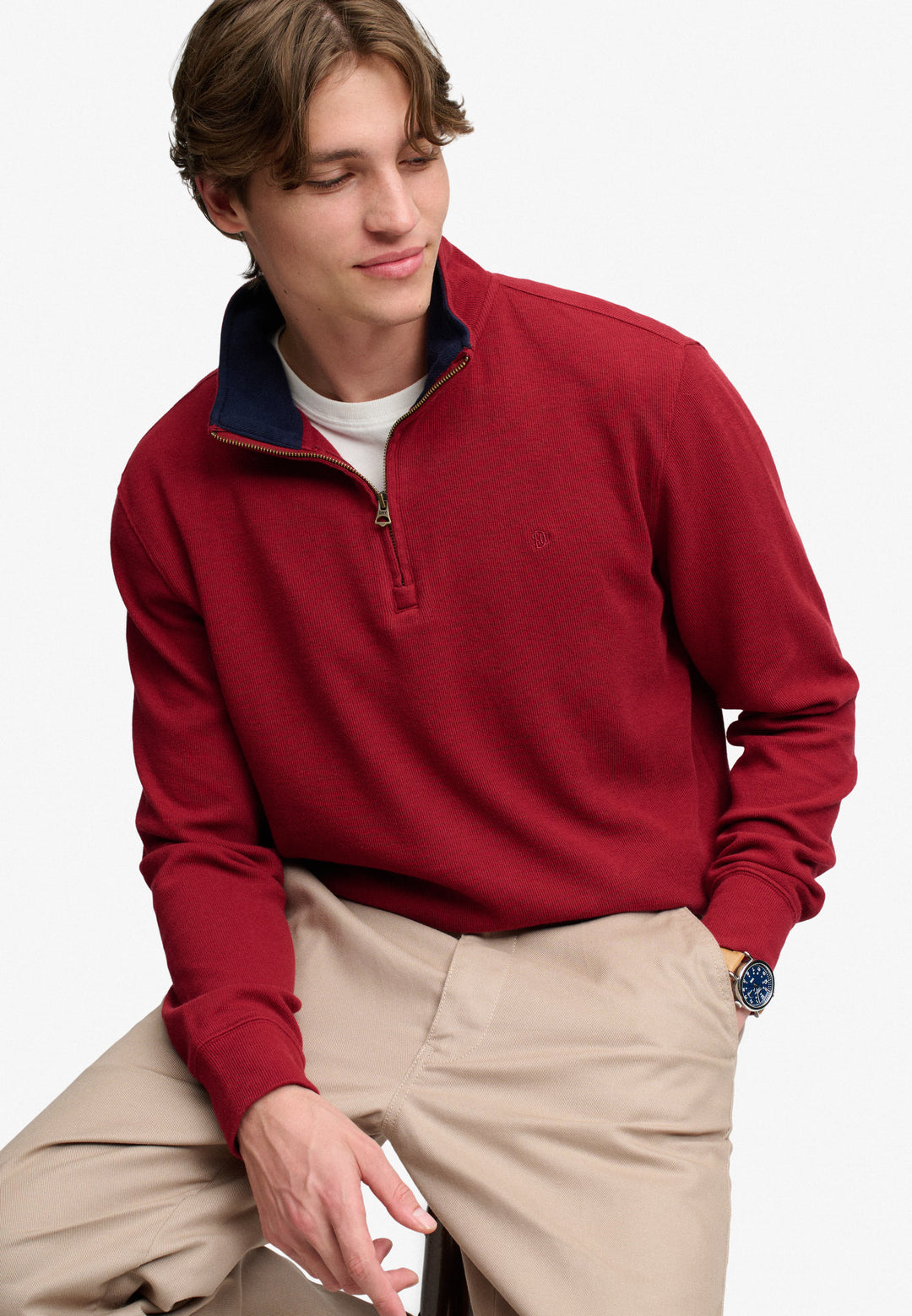 Men's burgundy half-zip top with contrast navy collar, ribbed hem, chest logo