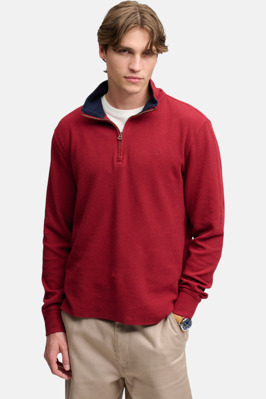 Men's burgundy quarter-zip pullover top with ribbed cuffs and small chest logo
