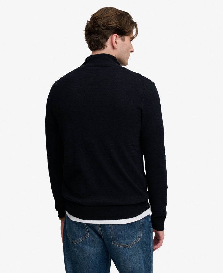 Navy half-zip sweater from back view, long sleeves and ribbed cuffs