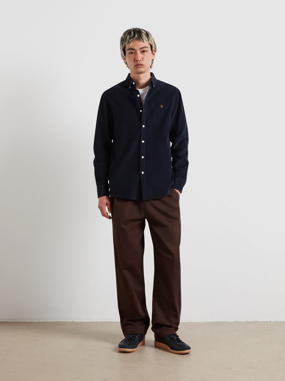 Navy plain long-sleeve button shirt with point collar and chest logo, full view.