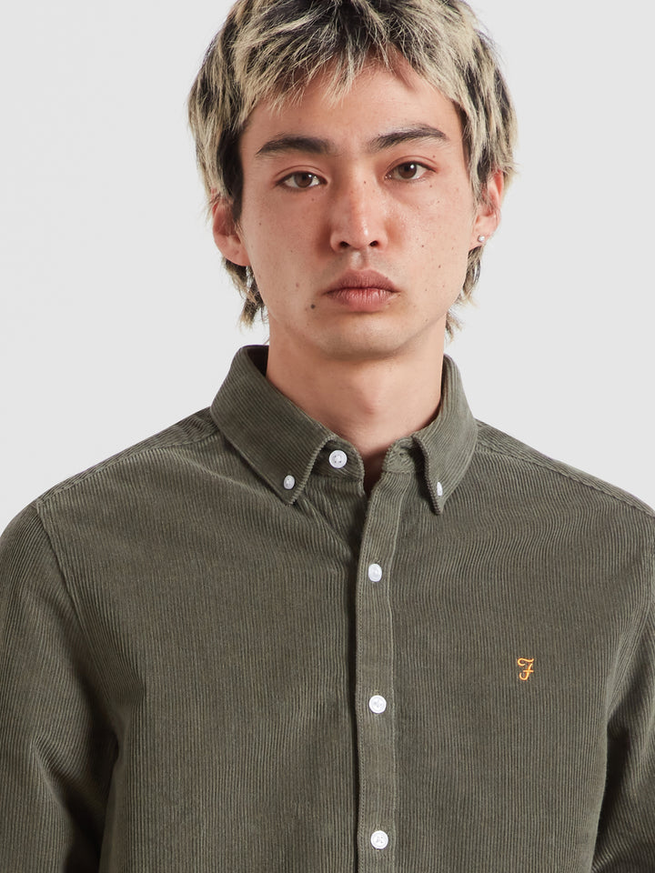 Long-sleeve button-down shirt in dark green corduroy, button front and collar