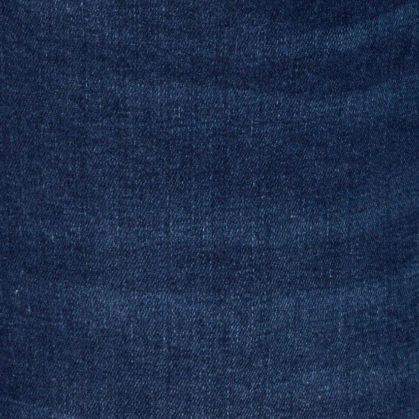 Blue jeans pocket with stitched seams and small logo patch on coin pocket