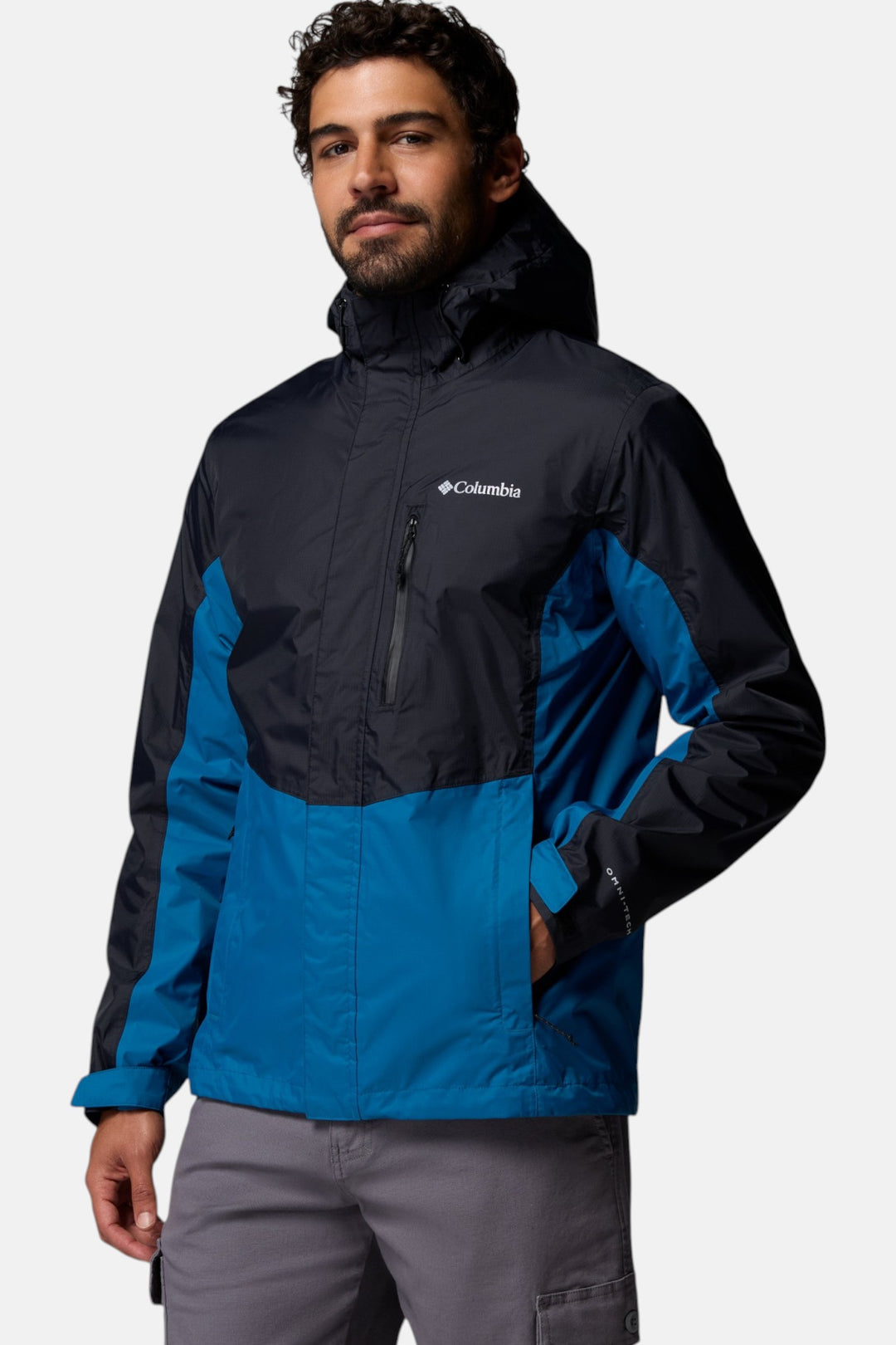 Men's hooded Columbia jacket in black with bright blue lower panels and side pocket
