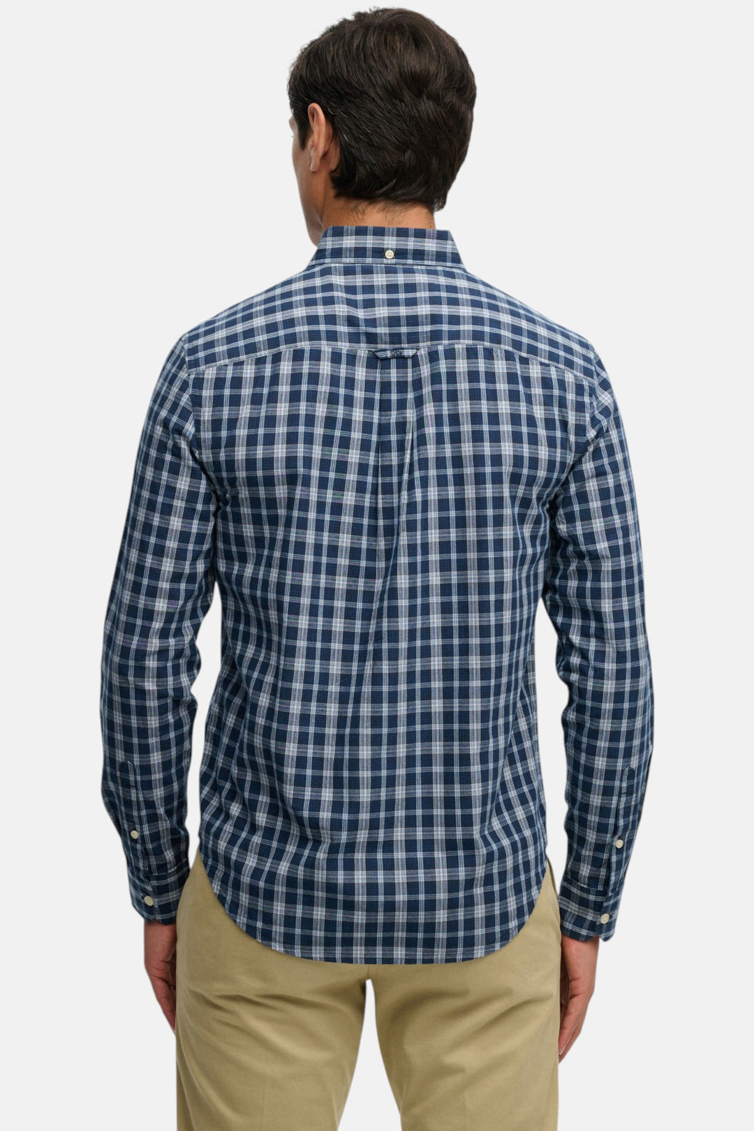 Men's long-sleeve navy check shirt, back view with yoke and curved hem
