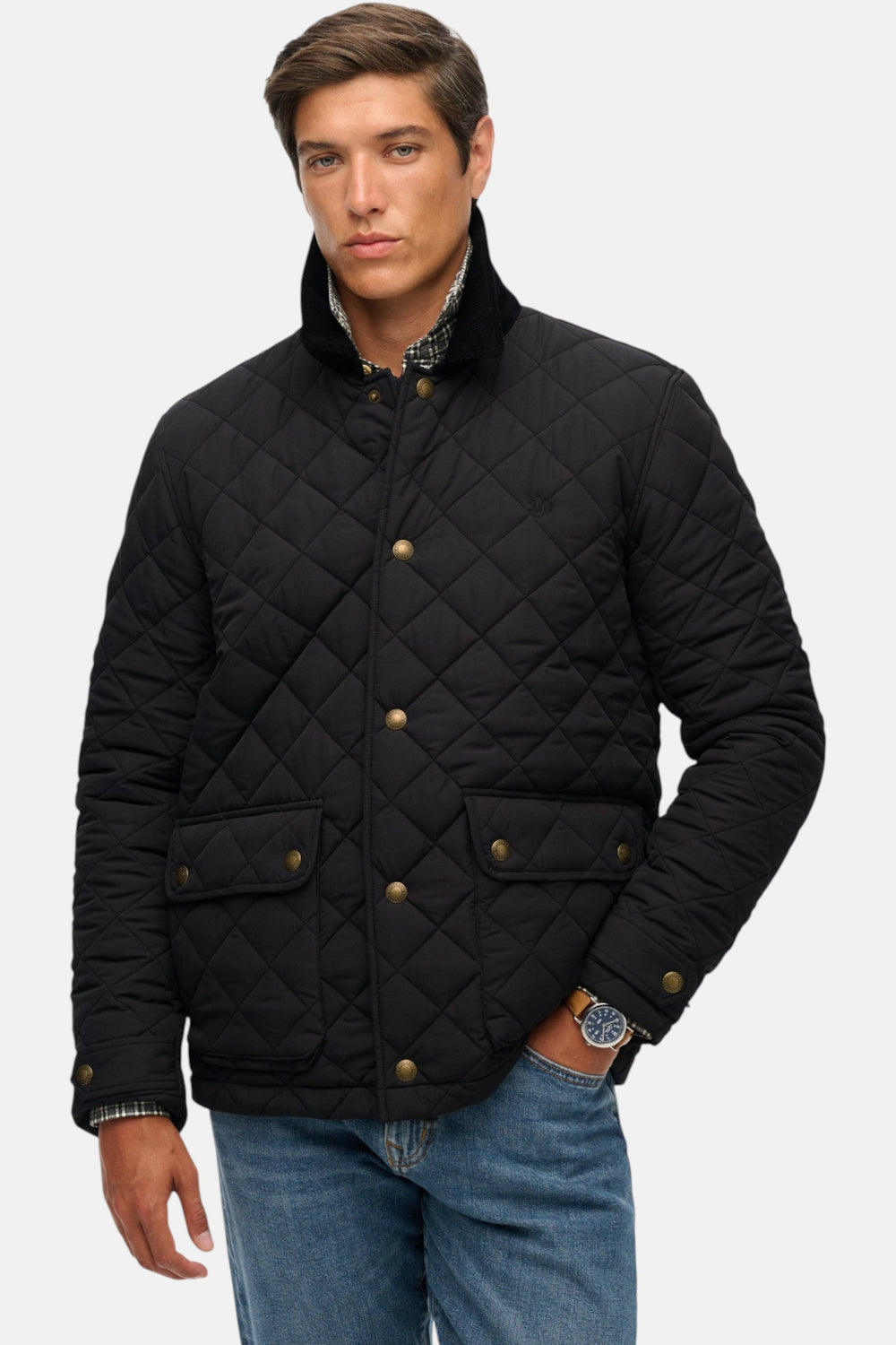 Quilted coach jacket in black, stand collar, gold buttons, two side snap pockets.