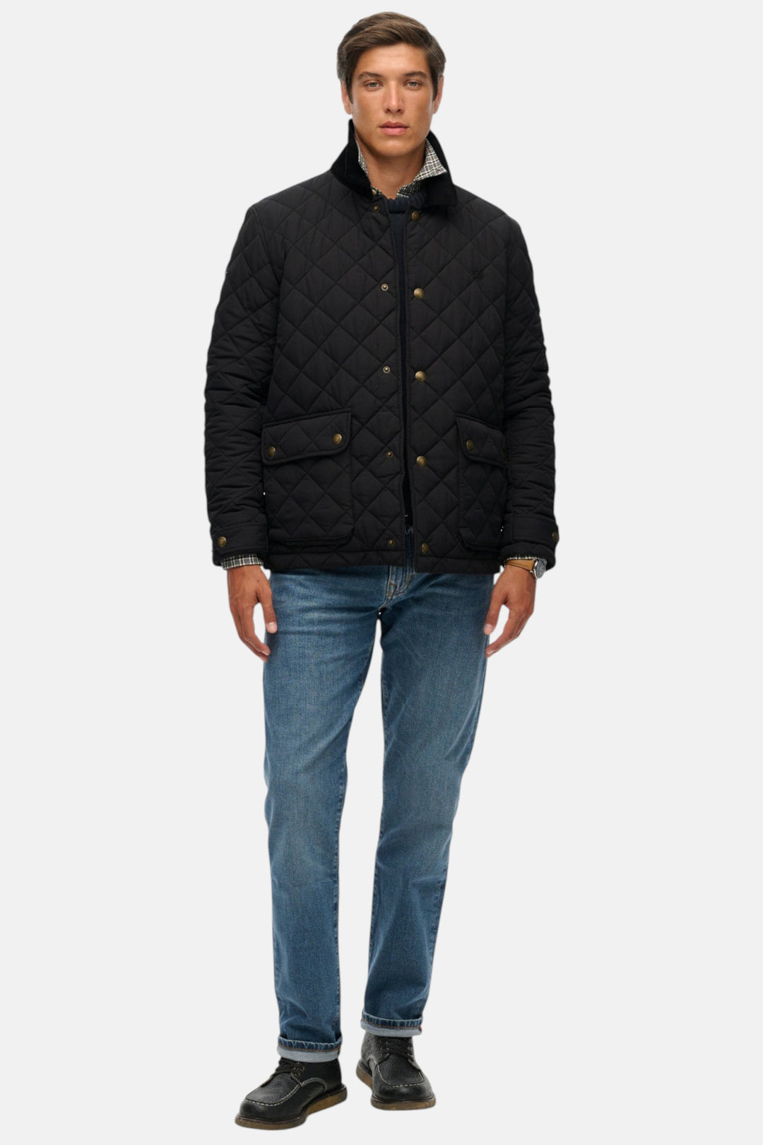 Men's quilted coach jacket in black, button-front, stand collar, chest pockets.
