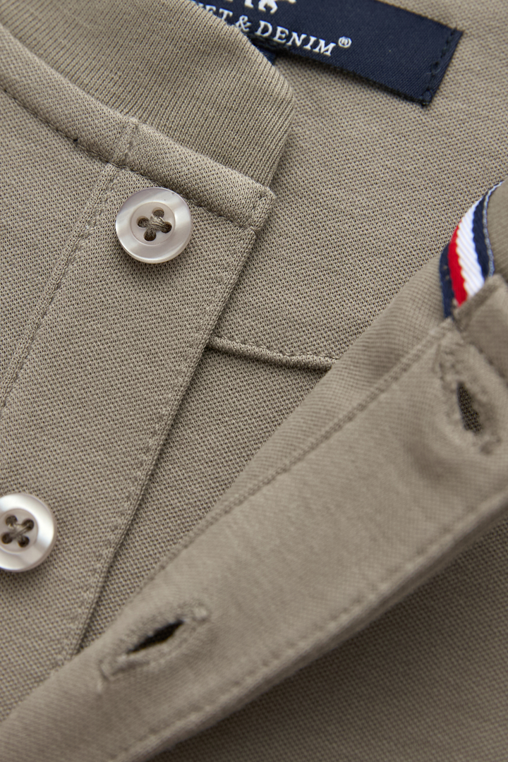 Grandad top button placket with buttons, buttonholes and striped inner trim