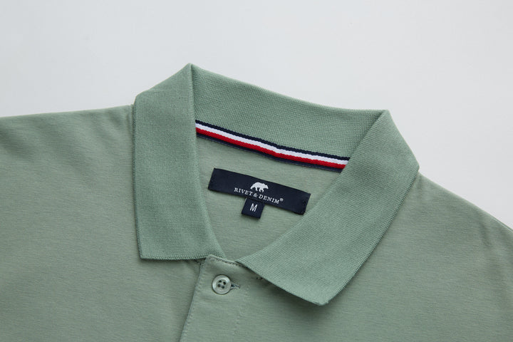 Mint polo shirt with foldover collar, button placket, and neck label