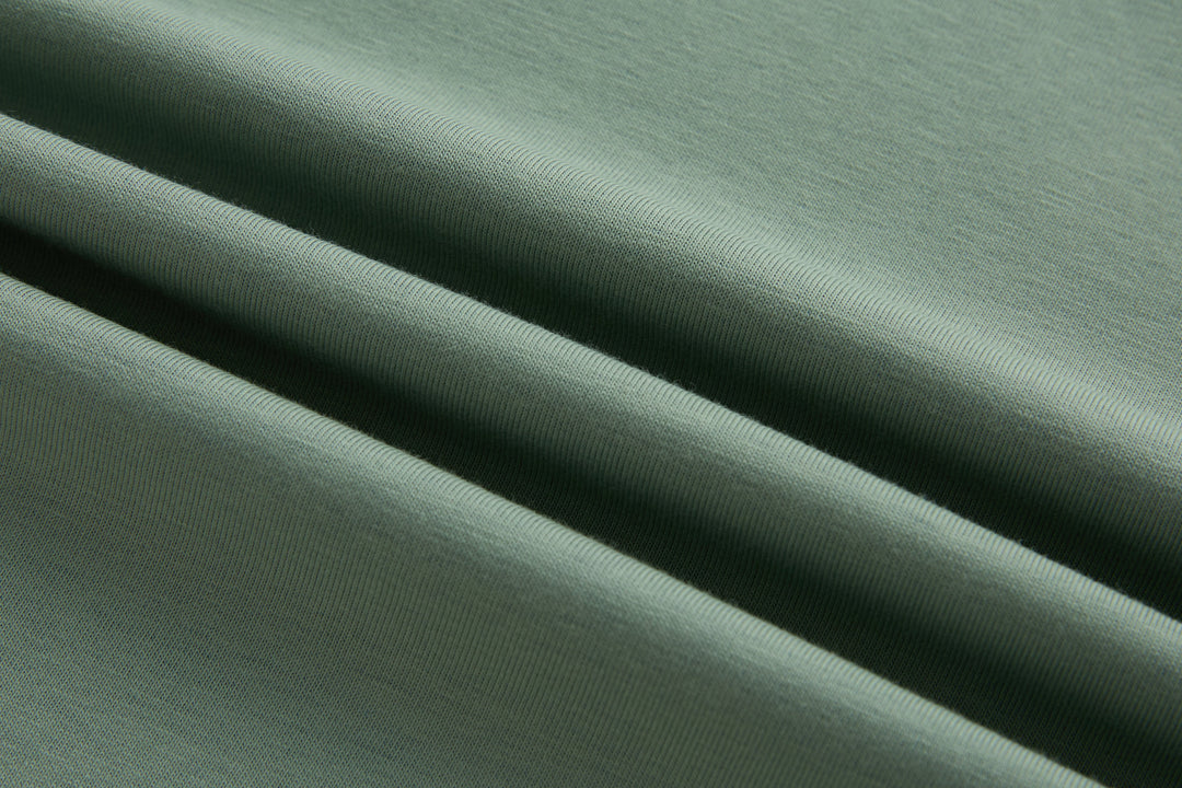 Mint polo shirt knit fabric close-up with fine texture