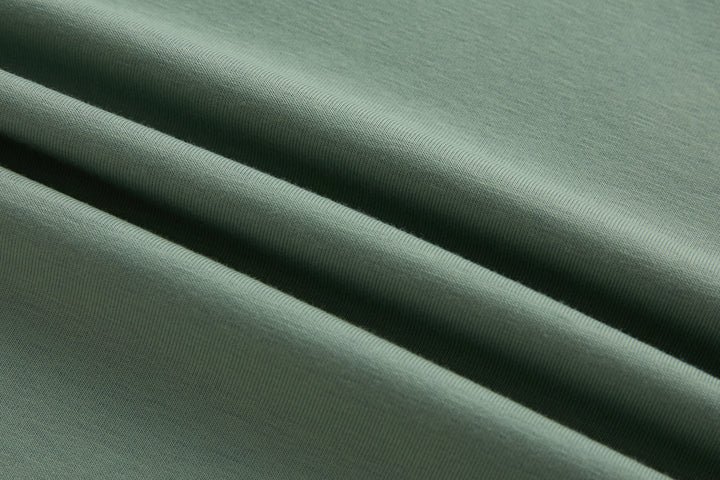 Mint polo shirt knit fabric close-up with fine texture