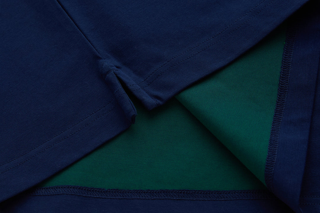 Navy polo shirt interior view showing green lining and seam detail