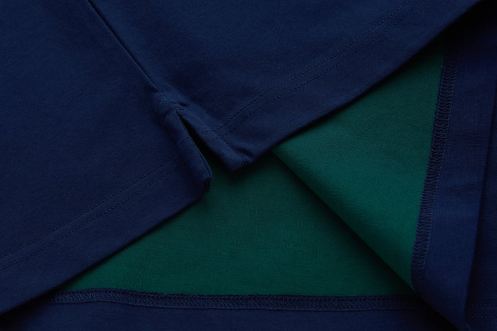 Navy polo shirt interior view showing green lining and seam detail