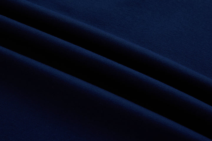 Navy polo shirt fabric close-up with smooth knit texture
