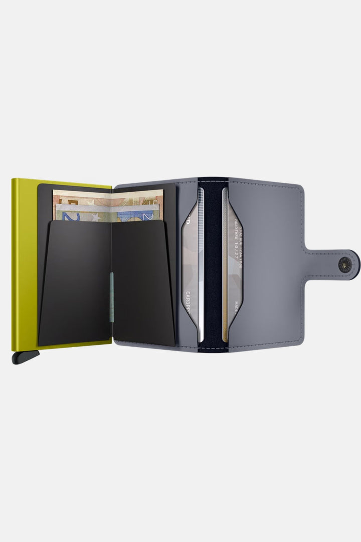Secrid miniwallet open, grey exterior with lime panel and card slots