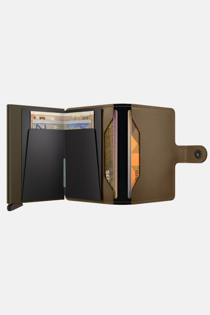 Secrid miniwallet open, showing card compartments and center cash divider