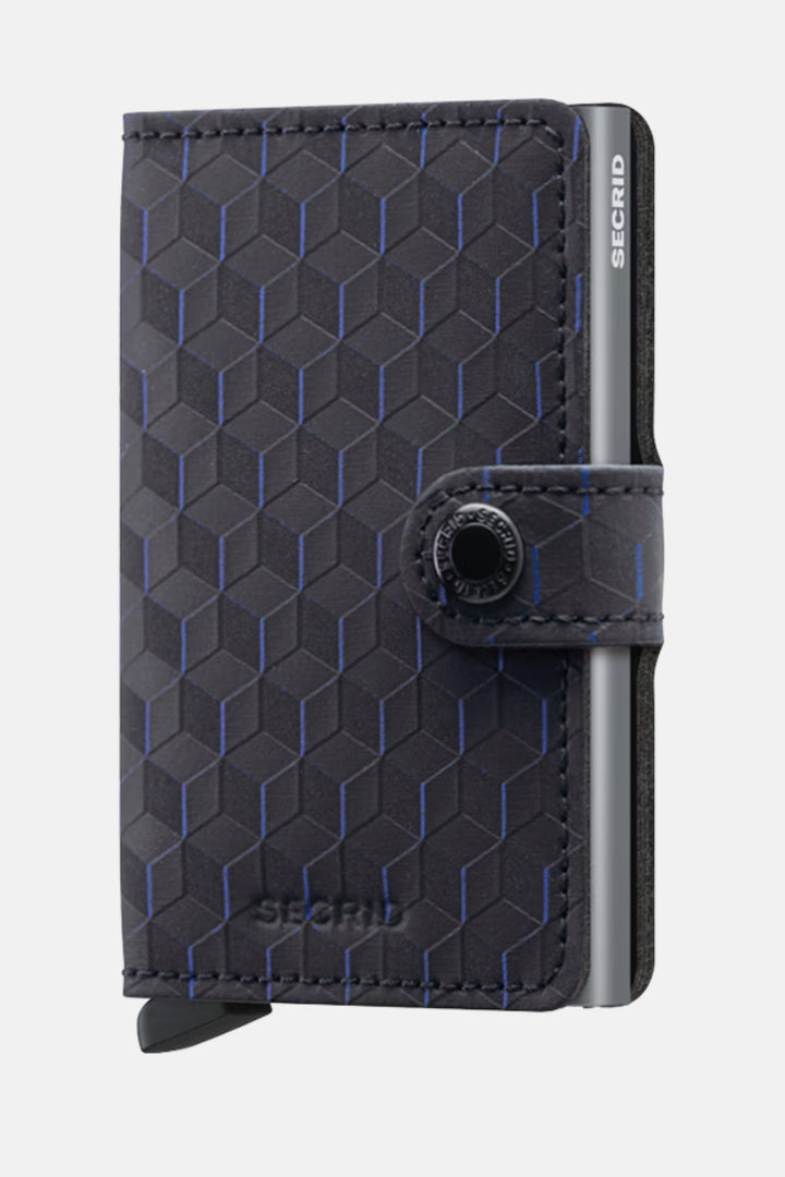 Secrid miniwallet with dark patterned leather, blue geometric grid, metal edge.