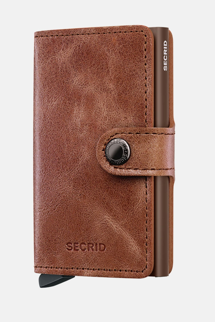 Secrid miniwallet in vintage cognac-brown leather with round metal button clasp