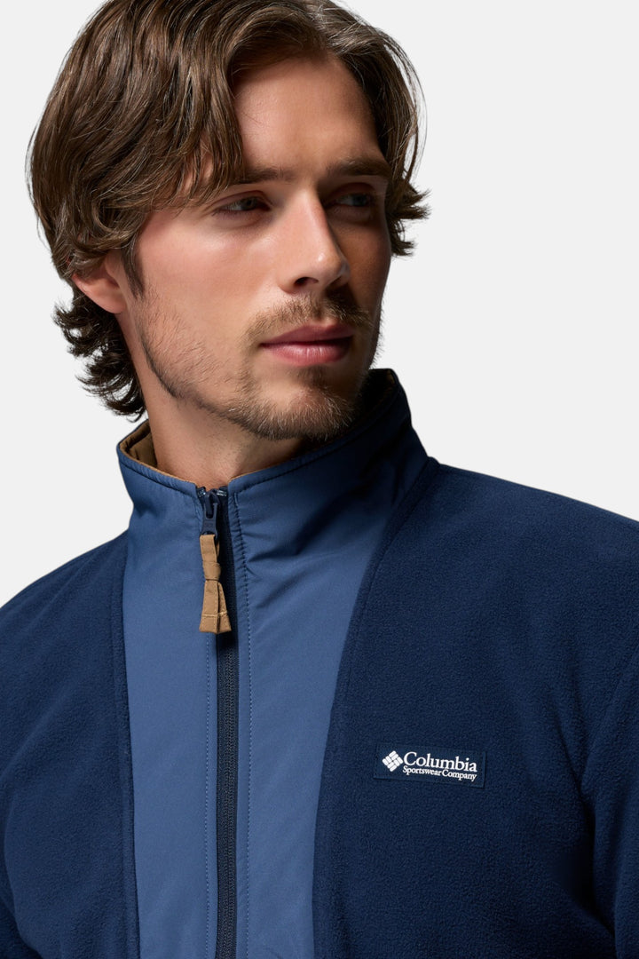 Columbia navy full-zip fleece jacket close-up with logo patch and zipper pull