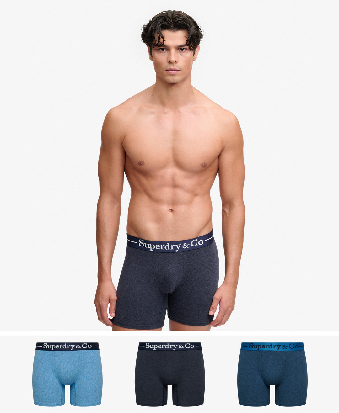 Three boxer briefs colors—light blue and dark navy—Superdry & Co waistbands.