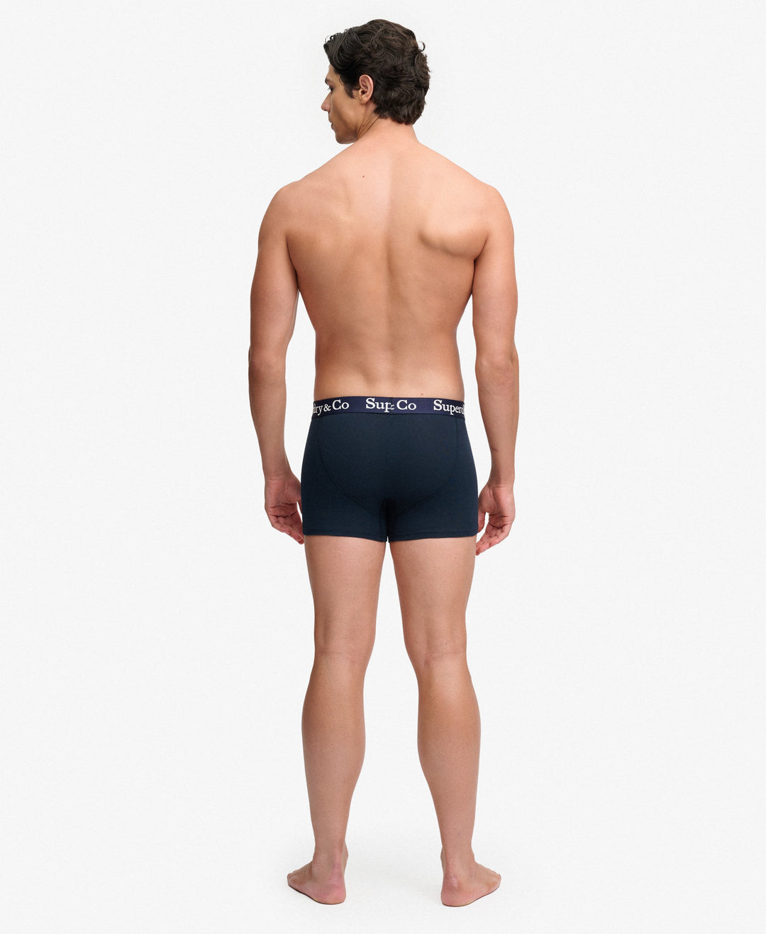 Men's navy boxer shorts on model, logo waistband, back view