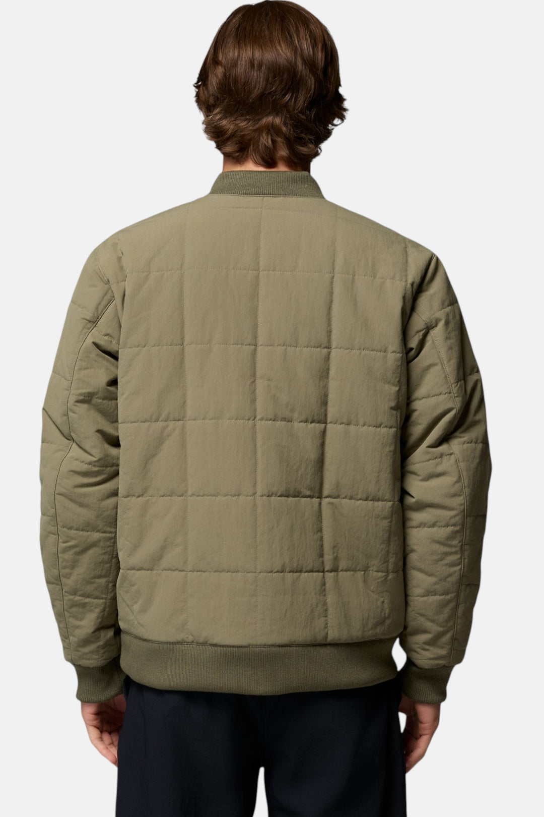 Men's bomber jacket in stone green, back view with quilted paneling and ribbed hem