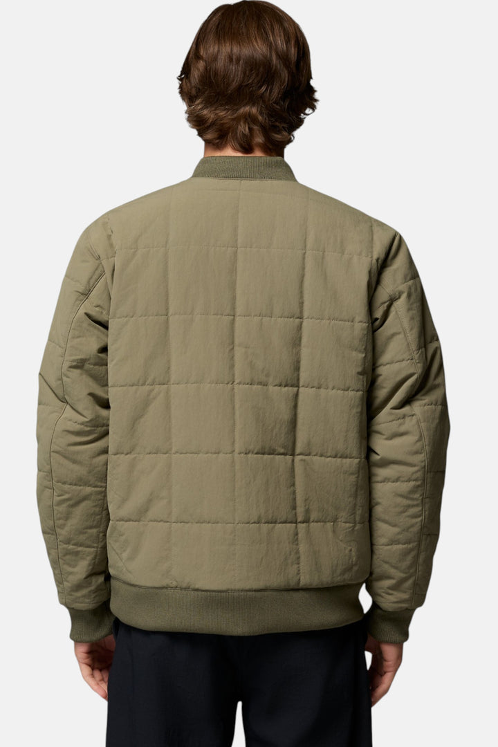 Men's bomber jacket in stone green, back view with quilted paneling and ribbed hem