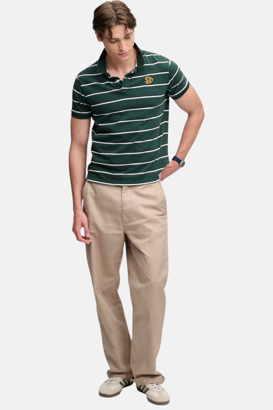 Green striped jersey polo shirt with collar and button placket, chest logo patch
